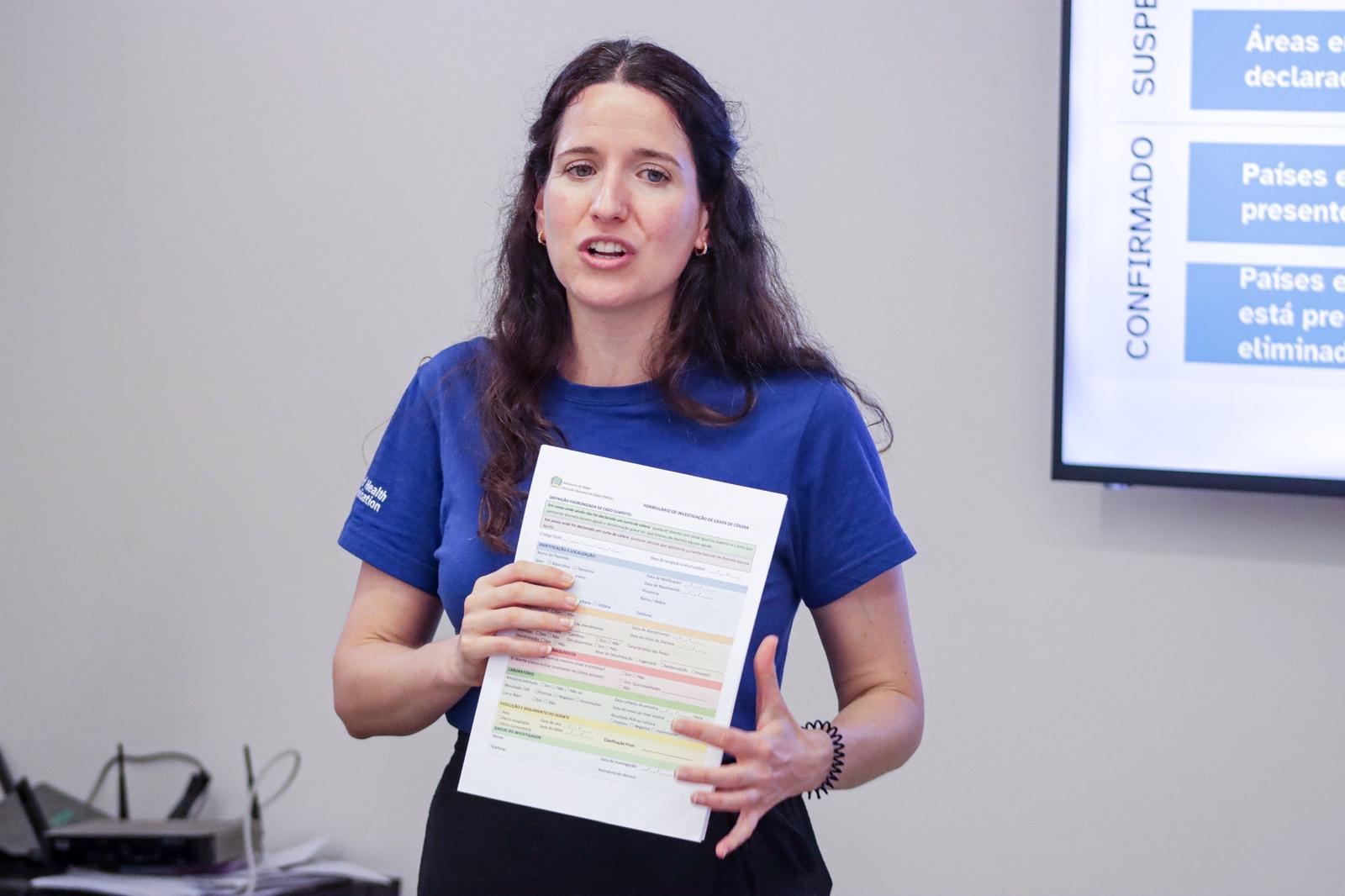 A trainor holding form